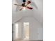 Attic bedroom featuring a ceiling fan and access to the bathroom at 2350 Shore View Nw Way, Suwanee, GA 30024