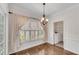 Charming breakfast nook with view to the backyard, and a laundry room to the side at 2350 Shore View Nw Way, Suwanee, GA 30024