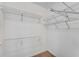 Walk-in closet with carpet flooring and multiple metal shelves for maximum storage space at 2350 Shore View Nw Way, Suwanee, GA 30024