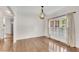 Dining room with hardwood floors, neutral paint, and bright windows at 2350 Shore View Nw Way, Suwanee, GA 30024