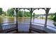 Picturesque lake view from a charming gazebo featuring built-in wooden benches at 2350 Shore View Nw Way, Suwanee, GA 30024
