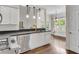 Modern kitchen with breakfast bar and stainless steel appliances overlooking breakfast nook at 2350 Shore View Nw Way, Suwanee, GA 30024