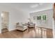 Inviting living room featuring hardwood floors and natural light at 2350 Shore View Nw Way, Suwanee, GA 30024
