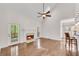 Cozy living room with a fireplace, and French doors leading to an outdoor space at 2350 Shore View Nw Way, Suwanee, GA 30024