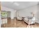 Bright living room with hardwood floors, natural lighting, and a view into the dining room at 2350 Shore View Nw Way, Suwanee, GA 30024