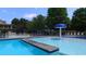Community pool featuring a mushroom water feature and lounge chairs for relaxation at 2350 Shore View Nw Way, Suwanee, GA 30024