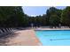 Large community swimming pool with plenty of lounge chairs for relaxing at 2350 Shore View Nw Way, Suwanee, GA 30024