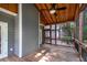 This screened porch features wood floors and ceiling and is ideal for entertaining or relaxing outdoors at 2350 Shore View Nw Way, Suwanee, GA 30024