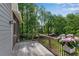 Enjoy outdoor living on this screened porch with a wooden floor and views of the lush backyard at 2350 Shore View Nw Way, Suwanee, GA 30024