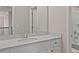 Bright bathroom featuring white cabinets, quartz countertop, and shower-tub combination at 2447 Cadenza Cir, Dacula, GA 30019