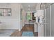 Inviting entryway with hardwood floors, elegant console table, and a glimpse into a comfortable living space at 2447 Cadenza Cir, Dacula, GA 30019