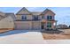 Charming brick home with a three-car garage and well-maintained landscaping, a picture of suburban comfort at 2447 Cadenza Cir, Dacula, GA 30019