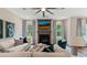 Cozy living room with fireplace, large windows, comfortable seating, and stylish decor creates a warm ambiance at 2447 Cadenza Cir, Dacula, GA 30019