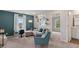 Cozy second-story living room with neutral colors, a couch, chair, and lots of natural light at 2447 Cadenza Cir, Dacula, GA 30019