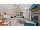 Inviting living room featuring a fireplace, ceiling fan, and stylish decor for comfortable living and entertaining at 2447 Cadenza Cir, Dacula, GA 30019