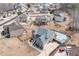 Aerial view of a home in a residential neighborhood showcasing the backyard pool and patio area at 2994 Ash Grove Sw Dr, Conyers, GA 30094