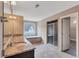 This bathroom features double sinks, a shower, and a bathtub by a window at 2994 Ash Grove Sw Dr, Conyers, GA 30094