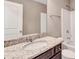 Bathroom featuring granite countertop vanity and a shower and tub combo at 2994 Ash Grove Sw Dr, Conyers, GA 30094
