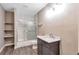 Bathroom featuring a vanity, shelves, and a shower and tub combo at 2994 Ash Grove Sw Dr, Conyers, GA 30094
