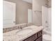 A traditional-style bathroom with dark wood cabinets and a granite countertop at 2994 Ash Grove Sw Dr, Conyers, GA 30094