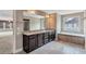 Well-lit bathroom featuring double vanity, tub, shower, and granite countertops at 2994 Ash Grove Sw Dr, Conyers, GA 30094
