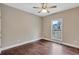 Cozy bedroom featuring a window and hardwood flooring at 2994 Ash Grove Sw Dr, Conyers, GA 30094