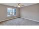 Bedroom featuring a large window and neutral-colored carpet at 2994 Ash Grove Sw Dr, Conyers, GA 30094