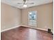 Simple yet bright bedroom with hardwood floors and a single window at 2994 Ash Grove Sw Dr, Conyers, GA 30094