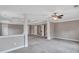 Spacious bonus room featuring neutral paint, plush carpeting, and a modern ceiling fan at 2994 Ash Grove Sw Dr, Conyers, GA 30094