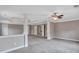 Spacious bonus room with neutral walls, ceiling fan, and column accents at 2994 Ash Grove Sw Dr, Conyers, GA 30094