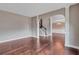 Open-concept dining room with hardwood floors and natural lighting at 2994 Ash Grove Sw Dr, Conyers, GA 30094