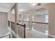 Elegant hallway showcasing archways, decorative railings, and stylish lighting fixtures at 2994 Ash Grove Sw Dr, Conyers, GA 30094