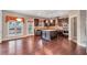 Gourmet kitchen featuring stainless appliances, a center island, and hardwood flooring at 2994 Ash Grove Sw Dr, Conyers, GA 30094