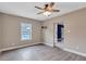 Inviting living room featuring luxury vinyl plank flooring and a ceiling fan at 2994 Ash Grove Sw Dr, Conyers, GA 30094