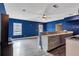 Open-concept living space with hardwood-style floors and view of the backyard at 2994 Ash Grove Sw Dr, Conyers, GA 30094