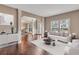 Bright living room with hardwood floors, elegant decor, large windows, and lots of natural light at 2994 Ash Grove Sw Dr, Conyers, GA 30094