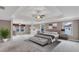Spacious main bedroom boasting a sitting area, tray ceilings, and ample natural light at 2994 Ash Grove Sw Dr, Conyers, GA 30094