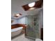 Bathroom features a freestanding tub and glass shower with wooden details at 406 Vivian Way, Woodstock, GA 30188