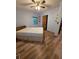Bedroom with wood floors, a window, and closet at 406 Vivian Way, Woodstock, GA 30188