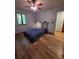 Bedroom with wood floors, ceiling fan and window that brings in natural light at 406 Vivian Way, Woodstock, GA 30188