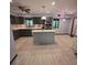 Spacious open kitchen features gray cabinets and a center island at 406 Vivian Way, Woodstock, GA 30188