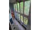 Living area featuring a wall of windows and tile and wood floors at 406 Vivian Way, Woodstock, GA 30188