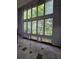 Bright living room boasts large windows and unique tiled floors at 406 Vivian Way, Woodstock, GA 30188