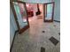 View of a living room with double doors, tiled flooring, and a wood-burning stove at 406 Vivian Way, Woodstock, GA 30188