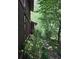 View of the side of the house with an area of trees and greenery at 406 Vivian Way, Woodstock, GA 30188