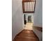 Wooden staircase leading to lower level, wood burning stove can be seen in the distance at 406 Vivian Way, Woodstock, GA 30188