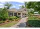 Attractive community clubhouse with manicured landscaping and inviting walkway at 7095 Evening Dew Dr, Cumming, GA 30028
