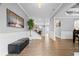 Open foyer with wood floors, a staircase, and ample natural light at 7095 Evening Dew Dr, Cumming, GA 30028