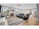 Spacious living room with a fireplace, and view to the kitchen at 7095 Evening Dew Dr, Cumming, GA 30028