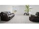 Bright living room featuring plush carpeting, ample natural light, and comfortable seating at 7095 Evening Dew Dr, Cumming, GA 30028